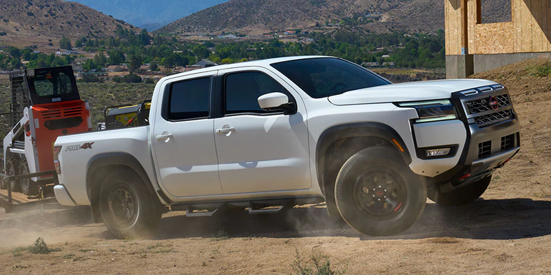 2026 White Nissan Frontier off-roading